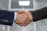 Close-up of a business handshake representing a successful partnership or agreement.